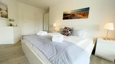 Ein Bett oder Betten in einem Zimmer der Unterkunft Ferienwohnung Nordseebrandung A3.3