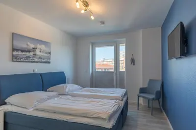 Ein Bett oder Betten in einem Zimmer der Unterkunft Quartier Hohe Geest - Wohnung Meerzeit