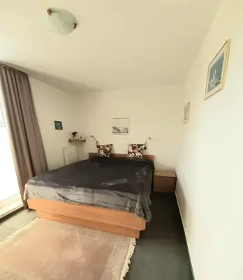 Ein Bett oder Betten in einem Zimmer der Unterkunft Residenz 08