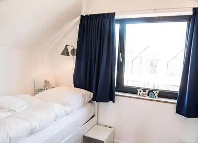 Ein Bett oder Betten in einem Zimmer der Unterkunft Beachhus