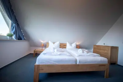 Ein Bett oder Betten in einem Zimmer der Unterkunft Ferienwohnung Hamburger Straße 7OG in Cuxhaven