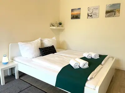 Ein Bett oder Betten in einem Zimmer der Unterkunft Ferienwohnung strandnah im Haus Frauenpreiss 56