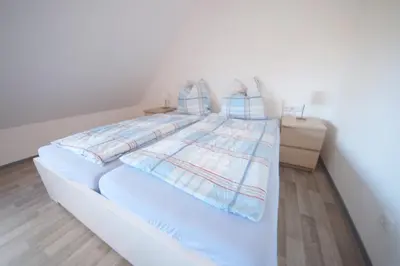 Ein Bett oder Betten in einem Zimmer der Unterkunft Appartementhaus Nige Ooge Ferienwohnung Nr. 12