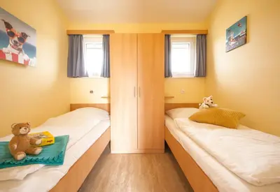 Ein Bett oder Betten in einem Zimmer der Unterkunft Ferienhaus Strandnixe