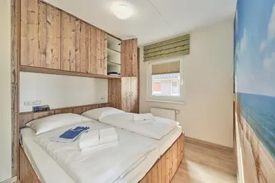 Ein Bett oder Betten in einem Zimmer der Unterkunft Haus Pamir - Fewo 24