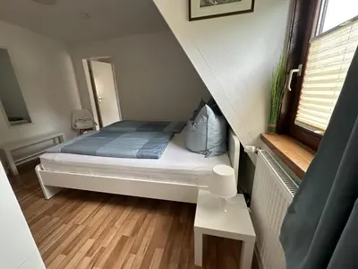 Ein Bett oder Betten in einem Zimmer der Unterkunft Gästehaus Bremer