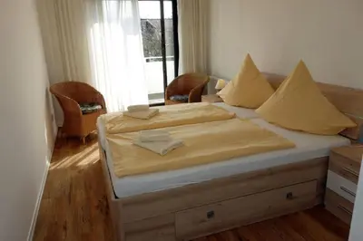 Ein Bett oder Betten in einem Zimmer der Unterkunft Herzmuschel
