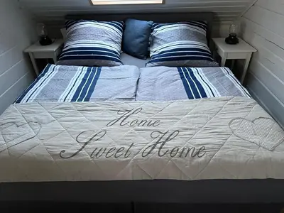 Ein Bett oder Betten in einem Zimmer der Unterkunft Ferienhaus Wiesenstrasse