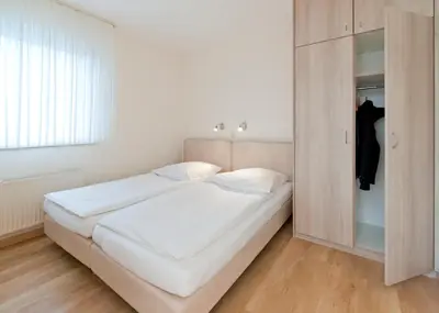 Ein Bett oder Betten in einem Zimmer der Unterkunft Haus Seemuschel - Fewo 5