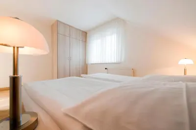 Ein Bett oder Betten in einem Zimmer der Unterkunft Haus Seemuschel - Fewo 9