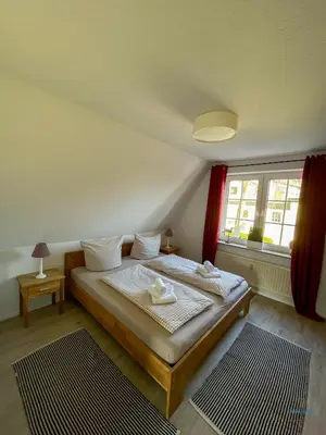 Ein Bett oder Betten in einem Zimmer der Unterkunft Landhaus Rosenhof Whg. 4