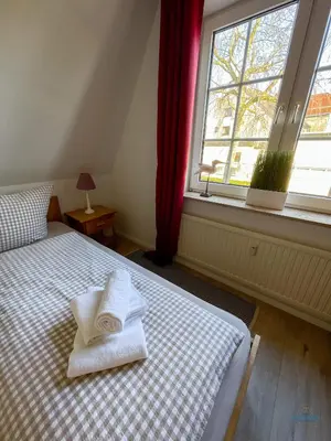 Ein Bett oder Betten in einem Zimmer der Unterkunft Landhaus Rosenhof Whg. 4