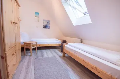 Ein Bett oder Betten in einem Zimmer der Unterkunft Ferienwohnung 'Möwe Whg. 4'