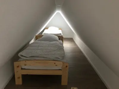 Ein Bett oder Betten in einem Zimmer der Unterkunft Ferienhaus Nordseerobbe