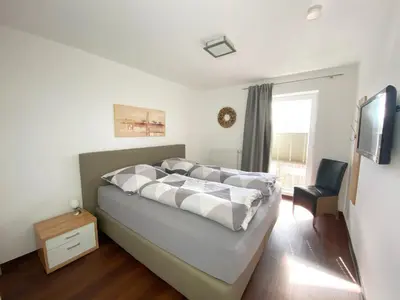 Ein Bett oder Betten in einem Zimmer der Unterkunft Ferienwohnungen Residenz Hohe Lith - Duhnen