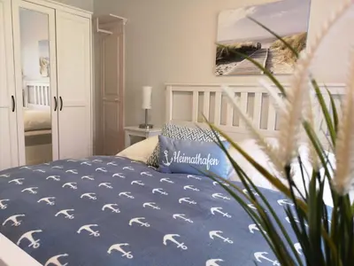 Ein Bett oder Betten in einem Zimmer der Unterkunft Elbstrom 09