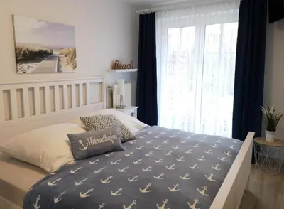 Ein Bett oder Betten in einem Zimmer der Unterkunft Elbstrom 09