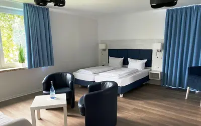 Ein Bett oder Betten in einem Zimmer der Unterkunft Gästehaus Blauth