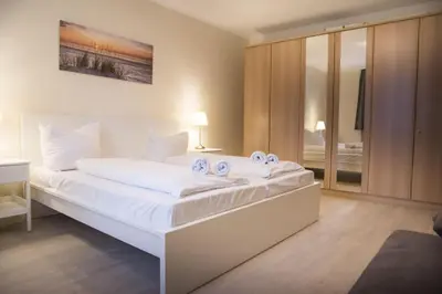 Ein Bett oder Betten in einem Zimmer der Unterkunft Am Sahlenburger Strand 1 Whg. 15