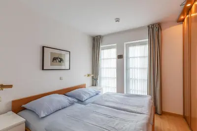 Ein Bett oder Betten in einem Zimmer der Unterkunft Haus Elbe 1 Wohnung 13