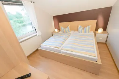 Ein Bett oder Betten in einem Zimmer der Unterkunft Ferienhaus Jette