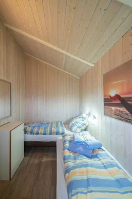 Ein Bett oder Betten in einem Zimmer der Unterkunft Ferienhaus Boldixum