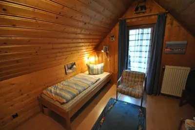 Ein Bett oder Betten in einem Zimmer der Unterkunft Ferienhaus Buddelschiff