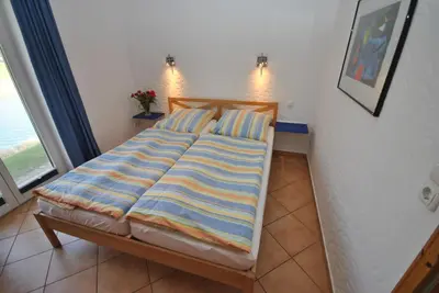 Ein Bett oder Betten in einem Zimmer der Unterkunft Ferienhaus Wattwurm