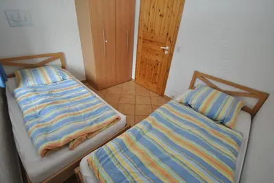 Ein Bett oder Betten in einem Zimmer der Unterkunft Ferienhaus Wattwurm