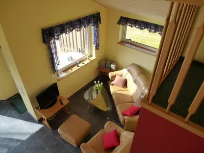 Ein Sitzbereich in der Unterkunft Ferienhaus Nordsee-Schwan