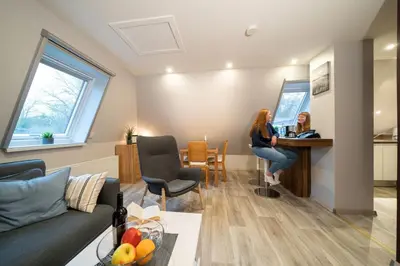 Ein Sitzbereich in der Unterkunft Ferienwohnung Kiebitz II