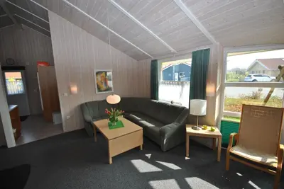 Ein Sitzbereich in der Unterkunft Ferienhaus Hus am See