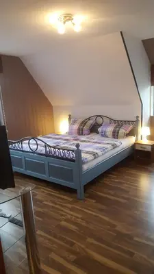 Ein Bett oder Betten in einem Zimmer der Unterkunft Ferienwohnung Schwiemann, Obergeschoss