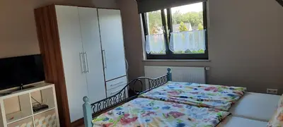 Ein Bett oder Betten in einem Zimmer der Unterkunft Ferienwohnung Schwiemann, Obergeschoss