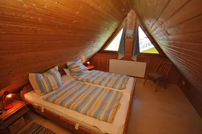 Ein Bett oder Betten in einem Zimmer der Unterkunft Ferienhaus Sturmtaucher