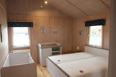Ein Bett oder Betten in einem Zimmer der Unterkunft Ferienhaus Nordseebrise
