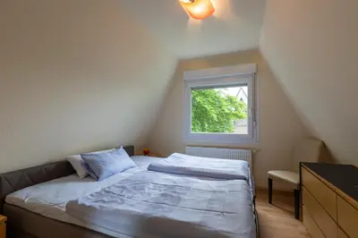Ein Bett oder Betten in einem Zimmer der Unterkunft Nordwind