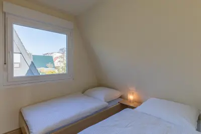 Ein Bett oder Betten in einem Zimmer der Unterkunft Nordwind