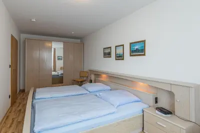 Ein Bett oder Betten in einem Zimmer der Unterkunft Residenz Meeresbrandung Wohnung 42