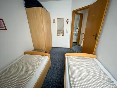 Ein Bett oder Betten in einem Zimmer der Unterkunft Ferienhaus Alter Duhner Weg 7h