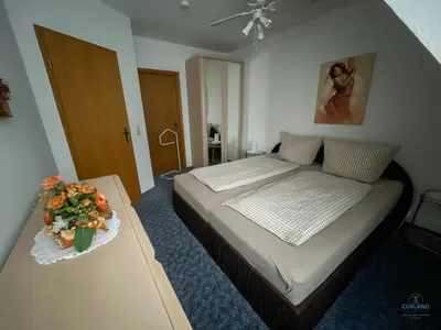 Ein Bett oder Betten in einem Zimmer der Unterkunft Ferienhaus Alter Duhner Weg 7h