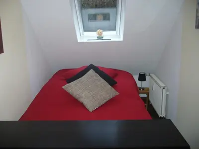 Ein Bett oder Betten in einem Zimmer der Unterkunft Voßhörn 27, Ferienwohnung 4