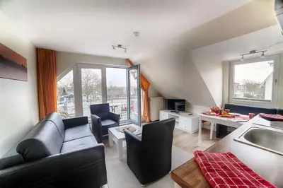 Ein Sitzbereich in der Unterkunft Dünenglück, Ferienwohnung 33