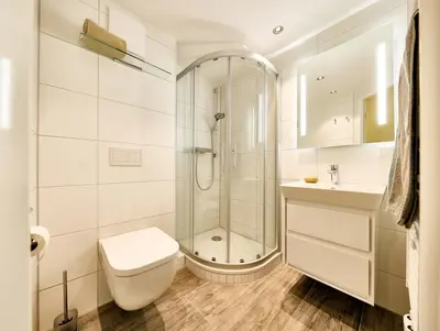 Ein Badezimmer in der Unterkunft Dünenglück, Ferienwohnung 13