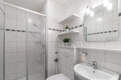 Ein Badezimmer in der Unterkunft Vogelsand 325