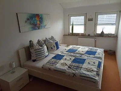 Ein Bett oder Betten in einem Zimmer der Unterkunft Ferienwohnung Sietland