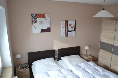Ein Bett oder Betten in einem Zimmer der Unterkunft Strandnahe Ferienwohnungen Duhnen inkl Fahrrädern Cuxhaven