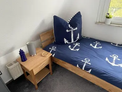 Ein Bett oder Betten in einem Zimmer der Unterkunft Kampweg 26
