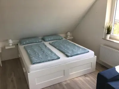 Ein Bett oder Betten in einem Zimmer der Unterkunft Ferienwohnung Ankerplatz