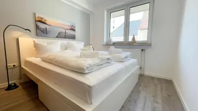 Ein Bett oder Betten in einem Zimmer der Unterkunft Nige Ooge 7
